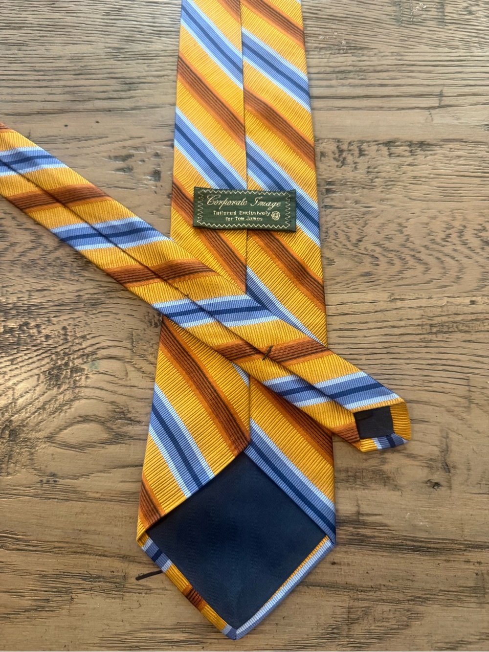 Tom James Men's Yellow Striped Silk Tie with Blue and Brown Accents